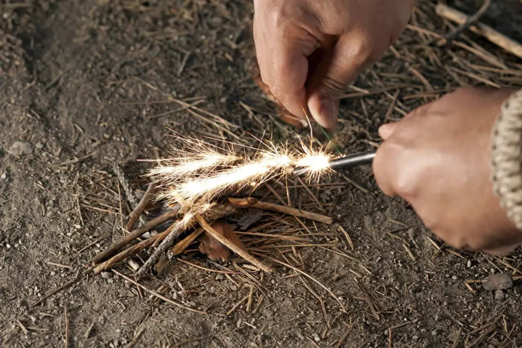 A outdoorsman Starting fire with Swedish fire steel (modern tools)