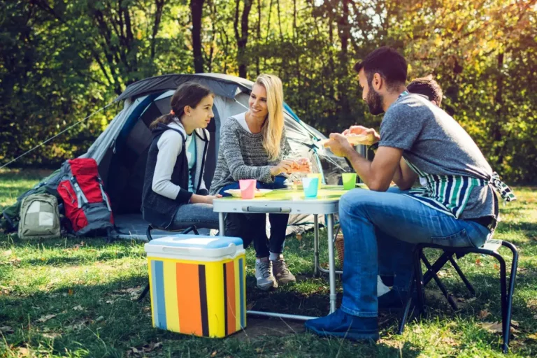A family famping with Cooler in forest