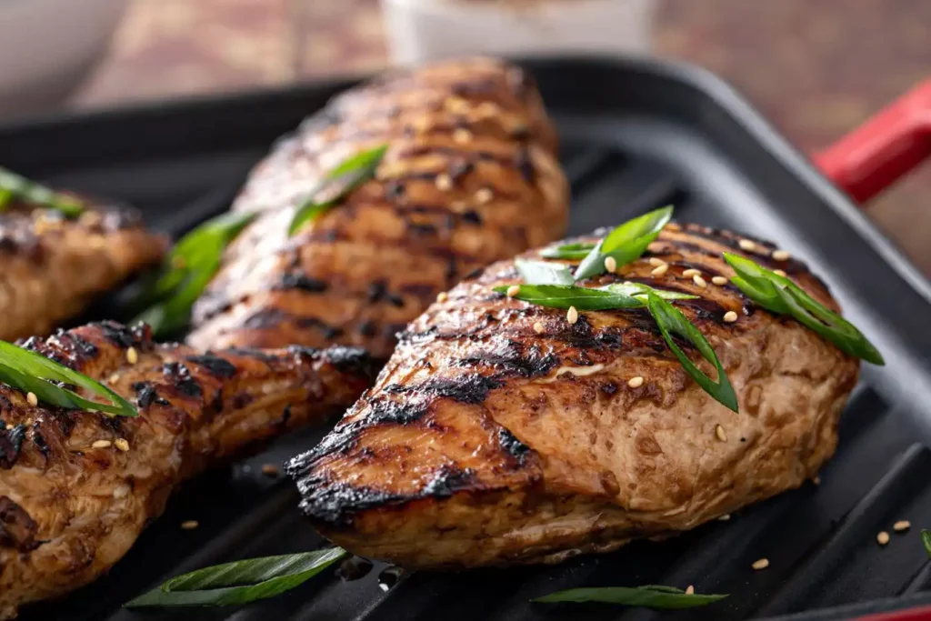 Grilled teriyaki chicken breast on a grill pan