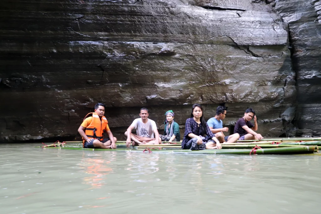 Group of friends in a big waterfall at Bandarban
