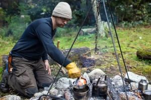 Man cooking over open flame